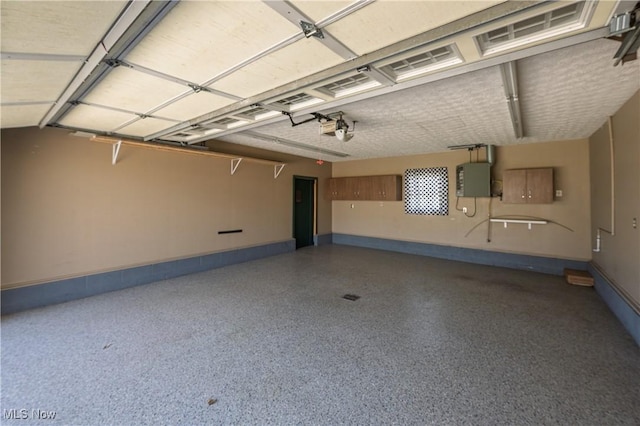 1181 S Broadway, New Philadelphia, OH 44663 - garage with baseboards and a garage door opener