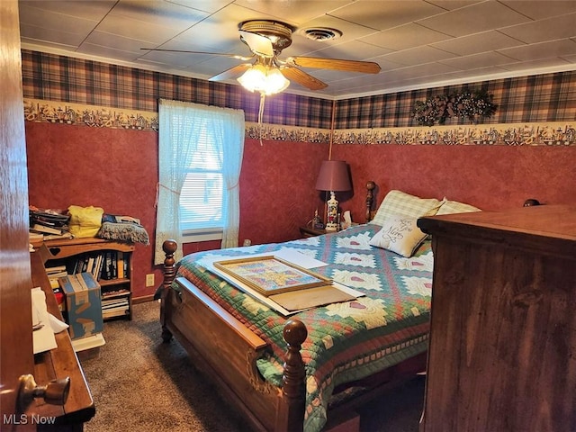 bedroom with wallpapered walls, visible vents, ceiling fan, and carpet floors