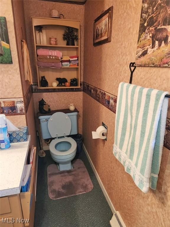 bathroom with toilet and visible vents