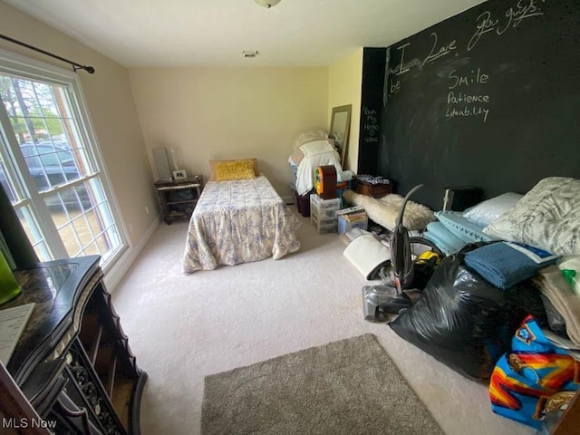 bedroom with carpet floors and visible vents