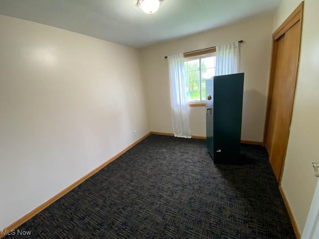empty room with baseboards