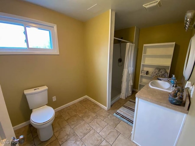 bathroom featuring a stall shower, toilet, baseboards, visible vents, and vanity