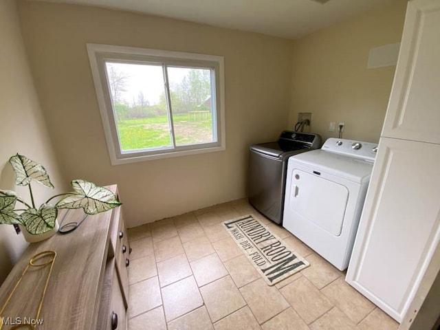 laundry room with light tile patterned floors and independent washer and dryer