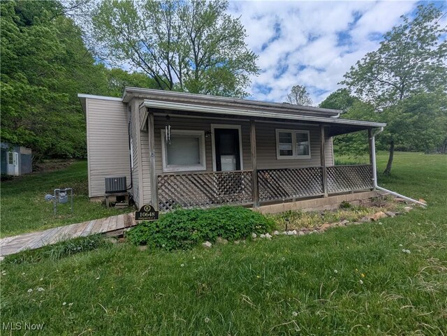 10648 State Route 37 E, New Lexington, OH 43764 - bungalow-style house with a front lawn, central AC unit, and covered porch