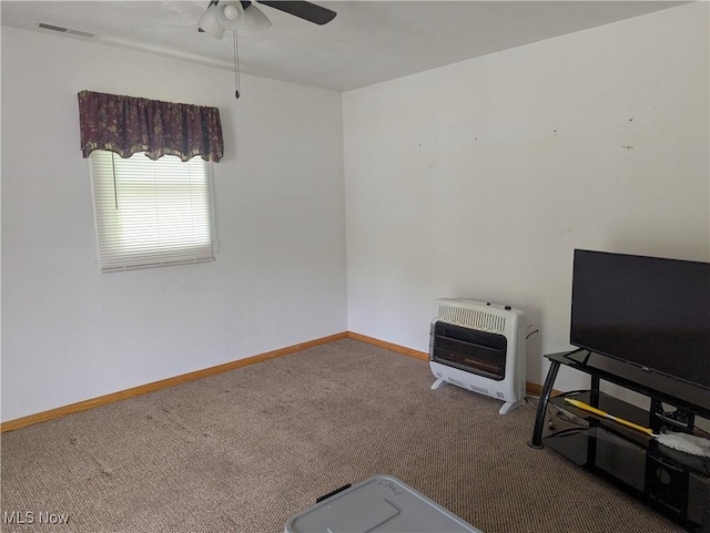 10648 State Route 37 E, New Lexington, OH 43764 - interior space with heating unit, baseboards, ceiling fan, visible vents, and carpet floors