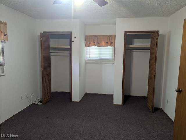 10648 State Route 37 E, New Lexington, OH 43764 - unfurnished bedroom featuring ceiling fan, a textured ceiling, carpet flooring, and multiple closets