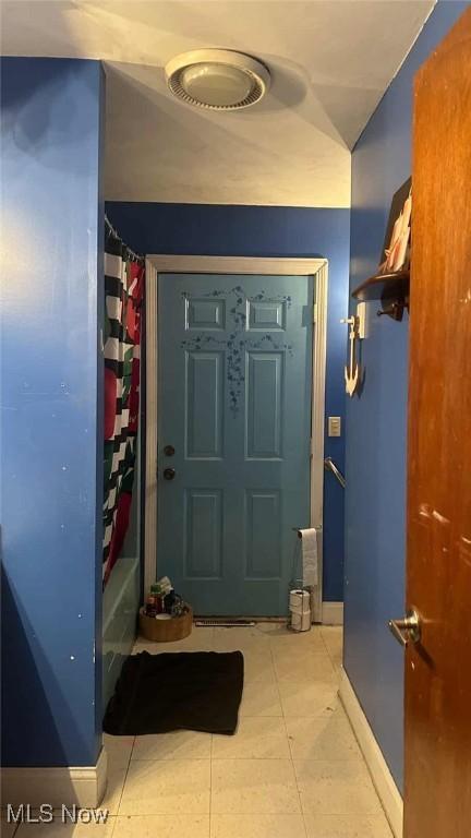 2320 Leetonia Rd, Leetonia, OH 44431 - doorway with light tile patterned floors and baseboards