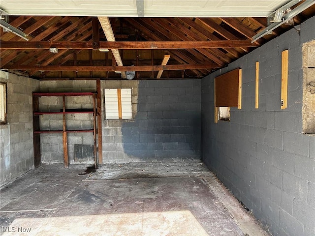 interior space with concrete block wall