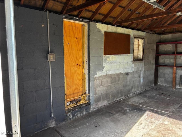 interior space with concrete block wall