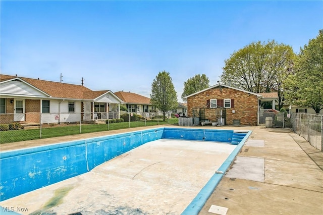view of swimming pool with fence, a fenced in pool, and a patio area