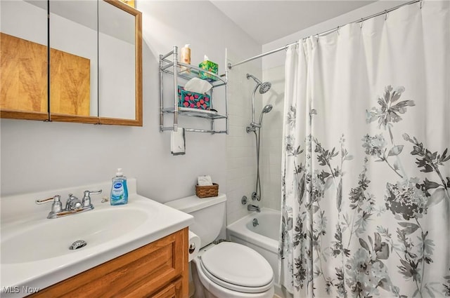 bathroom featuring toilet, vanity, and shower / bath combo