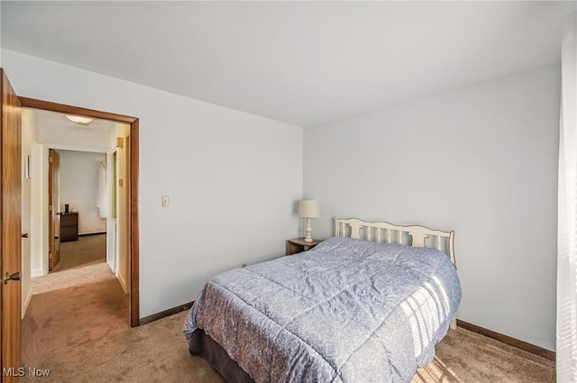 carpeted bedroom with baseboards