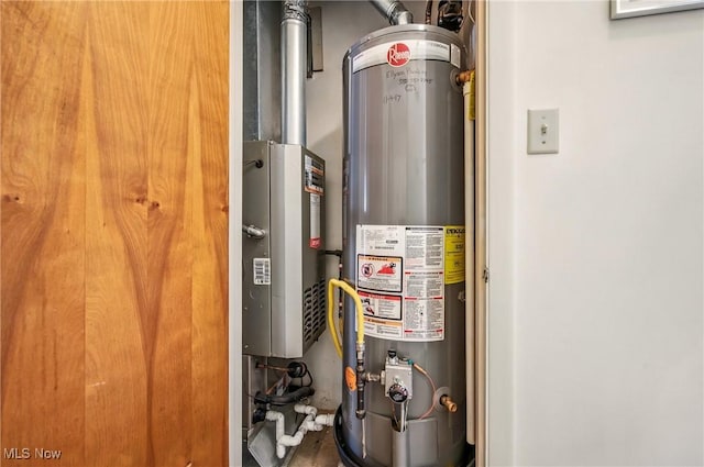 utility room featuring gas water heater