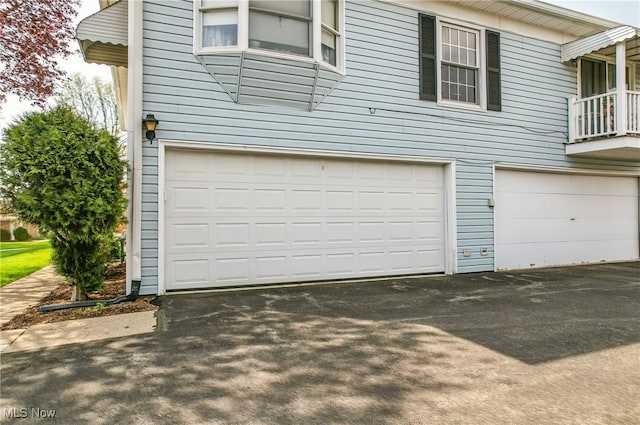garage with aphalt driveway