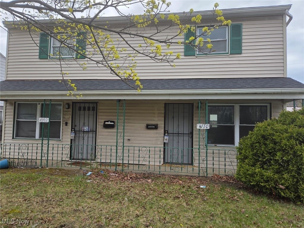 4110/4112 Fulton Pkwy, Cleveland, OH 44144 - traditional-style house with a porch and a front yard