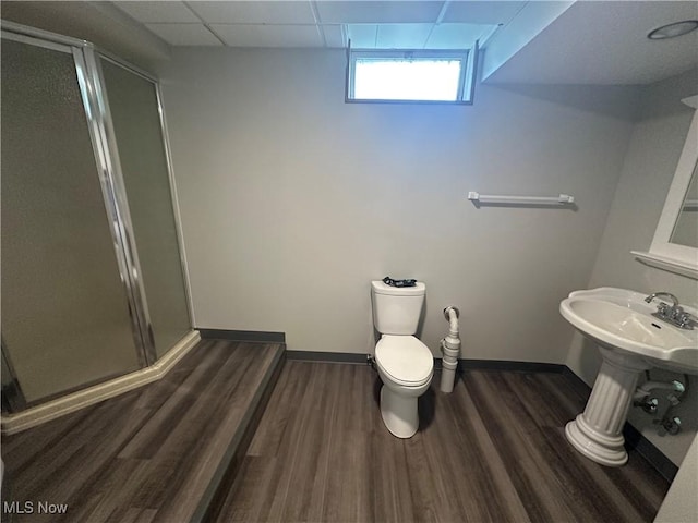 5869 Amy Boyle Rd NE, Brookfield, OH 44403 - bathroom with toilet, baseboards, a shower stall, and wood finished floors