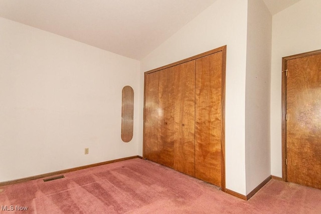 9122 Katherine Ct, Mentor, OH 44060 - unfurnished bedroom with lofted ceiling, a closet, visible vents, carpet flooring, and baseboards