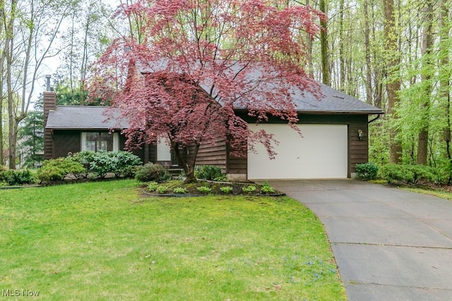 9122 Katherine Ct, Mentor, OH 44060 - view of front facade with concrete driveway, a front yard, a chimney, and a garage