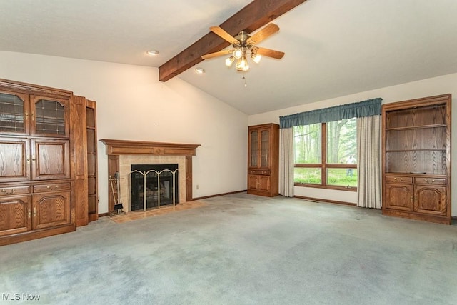 9122 Katherine Ct, Mentor, OH 44060 - unfurnished living room with lofted ceiling with beams, light carpet, a ceiling fan, baseboards, and a tiled fireplace