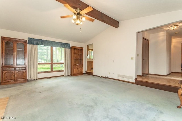 9122 Katherine Ct, Mentor, OH 44060 - unfurnished living room with a ceiling fan, baseboards, visible vents, light carpet, and vaulted ceiling with beams