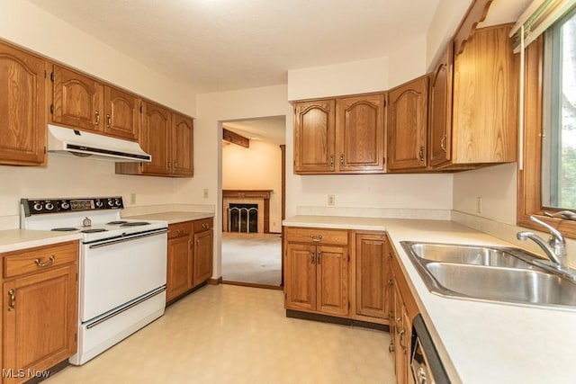 9122 Katherine Ct, Mentor, OH 44060 - kitchen with brown cabinets, a sink, white electric range, and under cabinet range hood