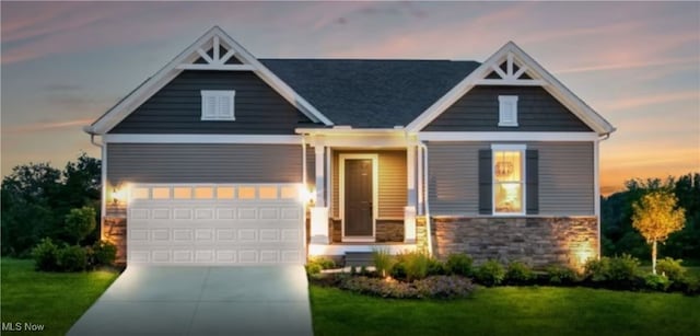 3991 Crestview Dr, Green, OH 44685 - craftsman-style house with concrete driveway, stone siding, and a front yard