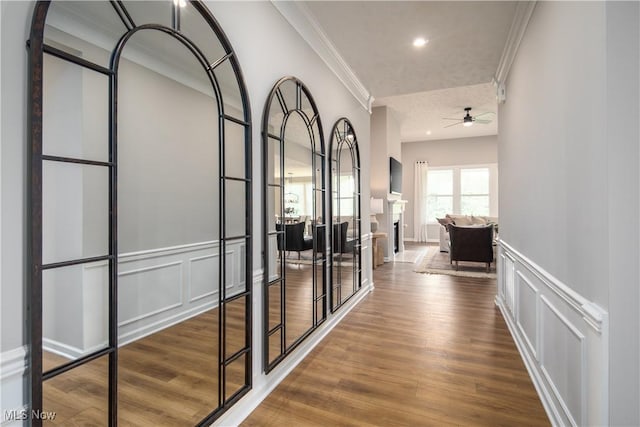 3991 Crestview Dr, Green, OH 44685 - corridor featuring ornamental molding, a decorative wall, wainscoting, and wood finished floors