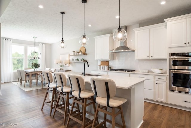 3991 Crestview Dr, Green, OH 44685 - kitchen with light countertops, a sink, stainless steel double oven, backsplash, and gas cooktop