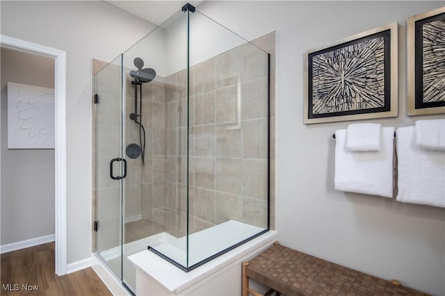 3991 Crestview Dr, Green, OH 44685 - bathroom with a stall shower, baseboards, and wood finished floors