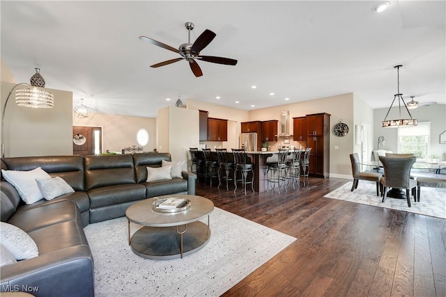 living room with ceiling fan, baseboards, dark wood-style floors, and recessed lighting
