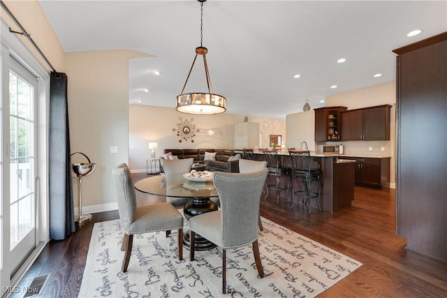 dining room with baseboards, visible vents, recessed lighting, and dark wood-type flooring