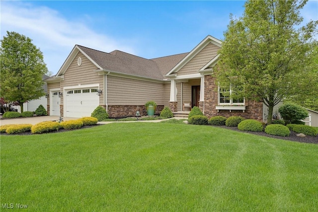 craftsman-style house with concrete driveway, a garage, a front lawn, and stone siding