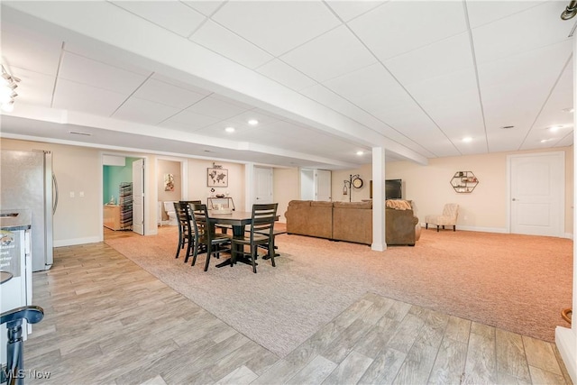 dining room with baseboards, recessed lighting, and wood finished floors