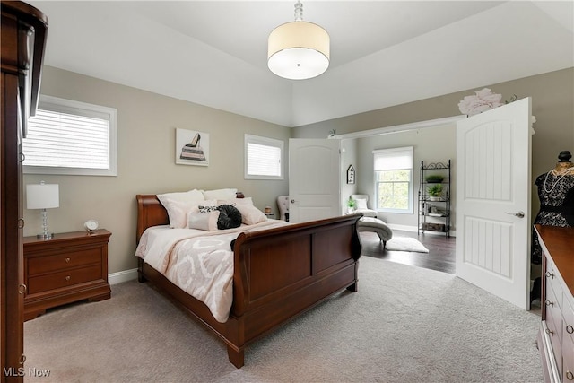 bedroom featuring carpet and baseboards