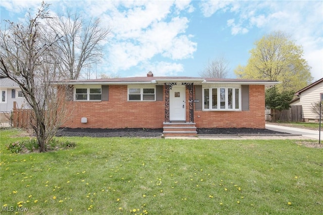 6544 Nancy Dr, North Olmsted, OH 44070 - ranch-style home with a front lawn, brick siding, and fence