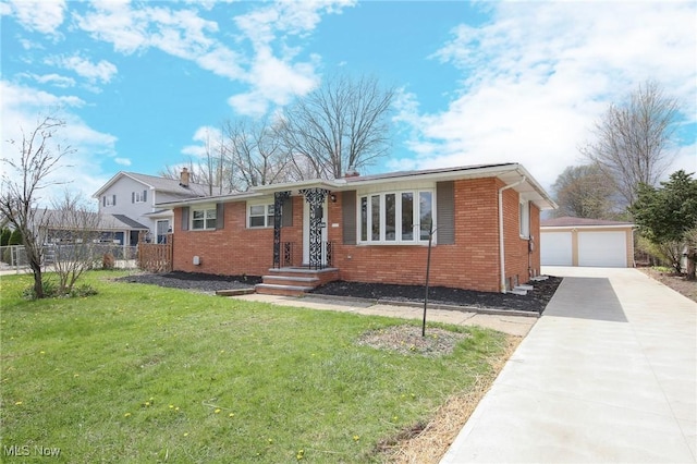 6544 Nancy Dr, North Olmsted, OH 44070 - ranch-style house featuring fence, a detached garage, brick siding, an outbuilding, and a front lawn