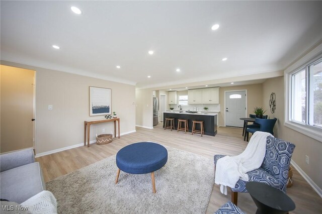 6544 Nancy Dr, North Olmsted, OH 44070 - living area with light wood-style floors, baseboards, and recessed lighting