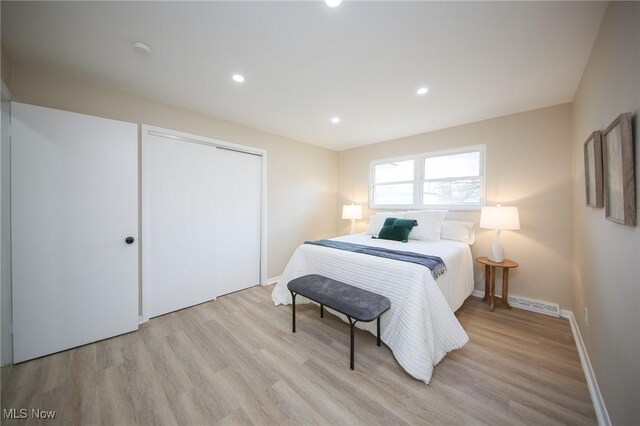 6544 Nancy Dr, North Olmsted, OH 44070 - bedroom featuring a closet, recessed lighting, baseboards, visible vents, and light wood-style floors