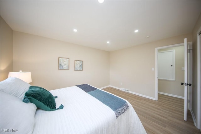 6544 Nancy Dr, North Olmsted, OH 44070 - bedroom featuring visible vents, wood finished floors, baseboards, and recessed lighting