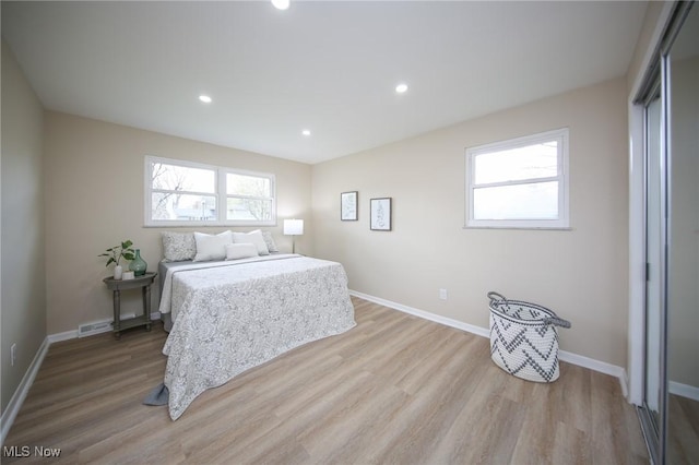 6544 Nancy Dr, North Olmsted, OH 44070 - bedroom featuring multiple windows and wood finished floors