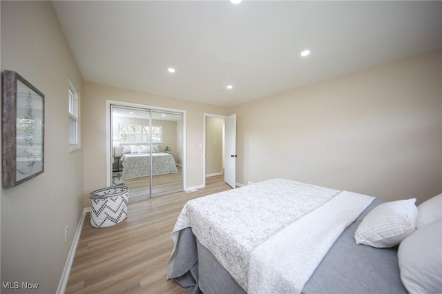 6544 Nancy Dr, North Olmsted, OH 44070 - bedroom featuring a closet, baseboards, light wood-style flooring, and recessed lighting