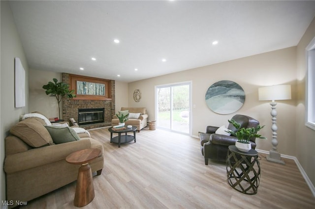 6544 Nancy Dr, North Olmsted, OH 44070 - living area with baseboards, a fireplace, recessed lighting, and wood finished floors