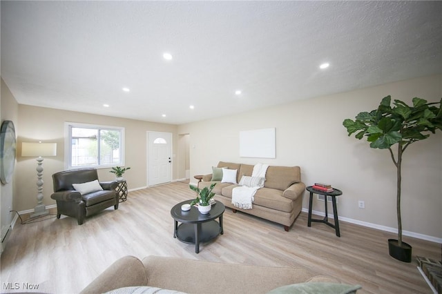 6544 Nancy Dr, North Olmsted, OH 44070 - living room featuring wood finished floors, baseboards, and recessed lighting