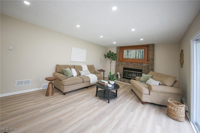 6544 Nancy Dr, North Olmsted, OH 44070 - living room with light wood finished floors, baseboards, visible vents, and recessed lighting