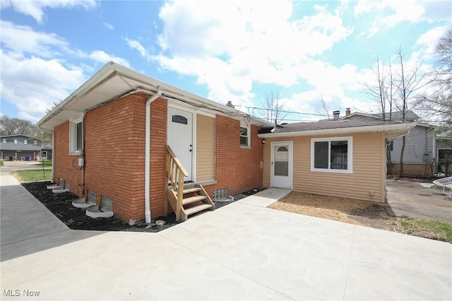 6544 Nancy Dr, North Olmsted, OH 44070 - view of front of house with a patio area, entry steps, and brick siding
