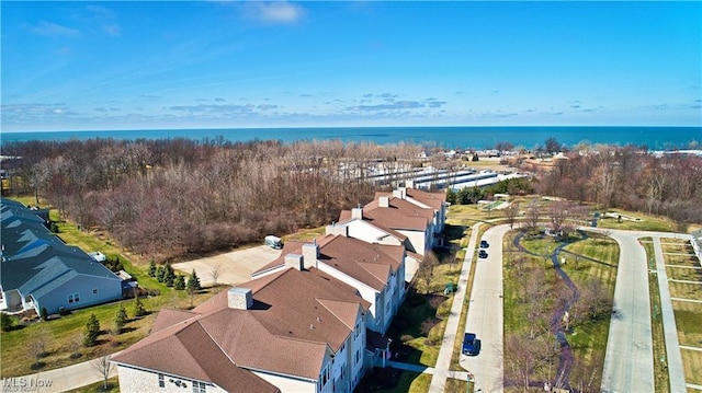 bird's eye view featuring a water view and a residential view