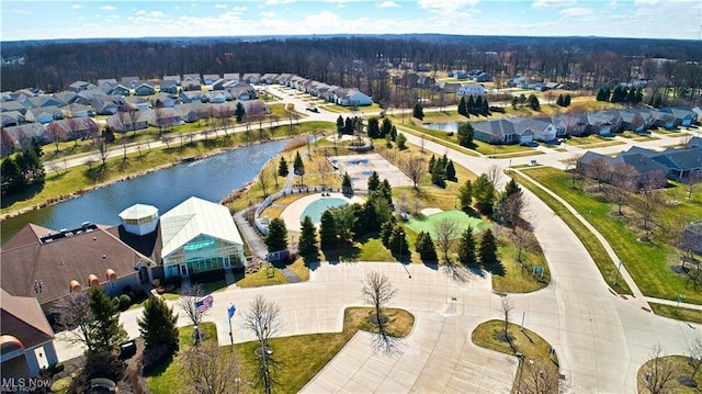 aerial view with a water view and a residential view