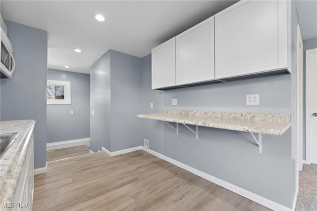 laundry room with light wood-style floors, baseboards, and recessed lighting
