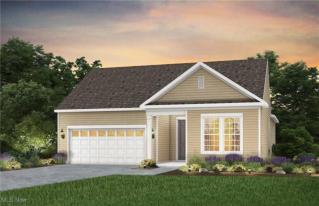 view of front of house with driveway, a shingled roof, a garage, and a front yard