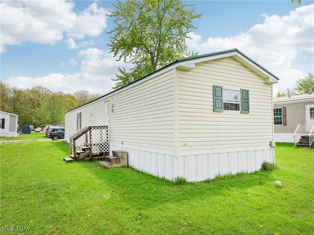 184 Garfield Ln, Jefferson, OH 44047 - view of home's exterior with a yard